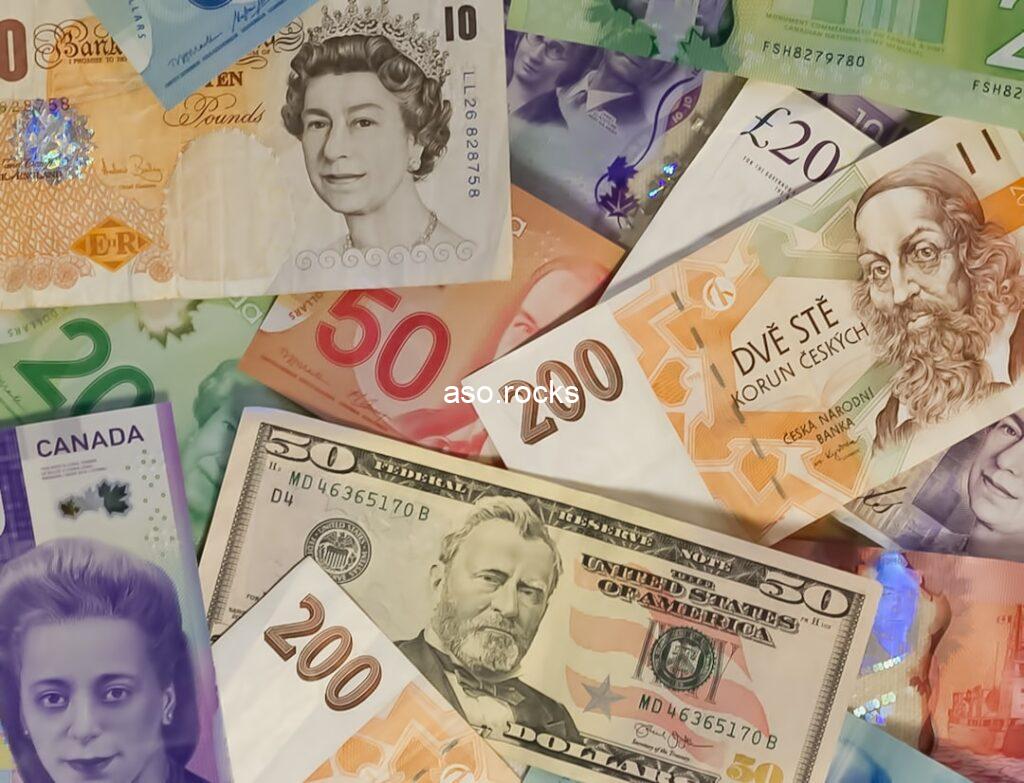 Multiple world currencies including British pound sterling notes spread out, illustrating the official versus parallel market rate gap