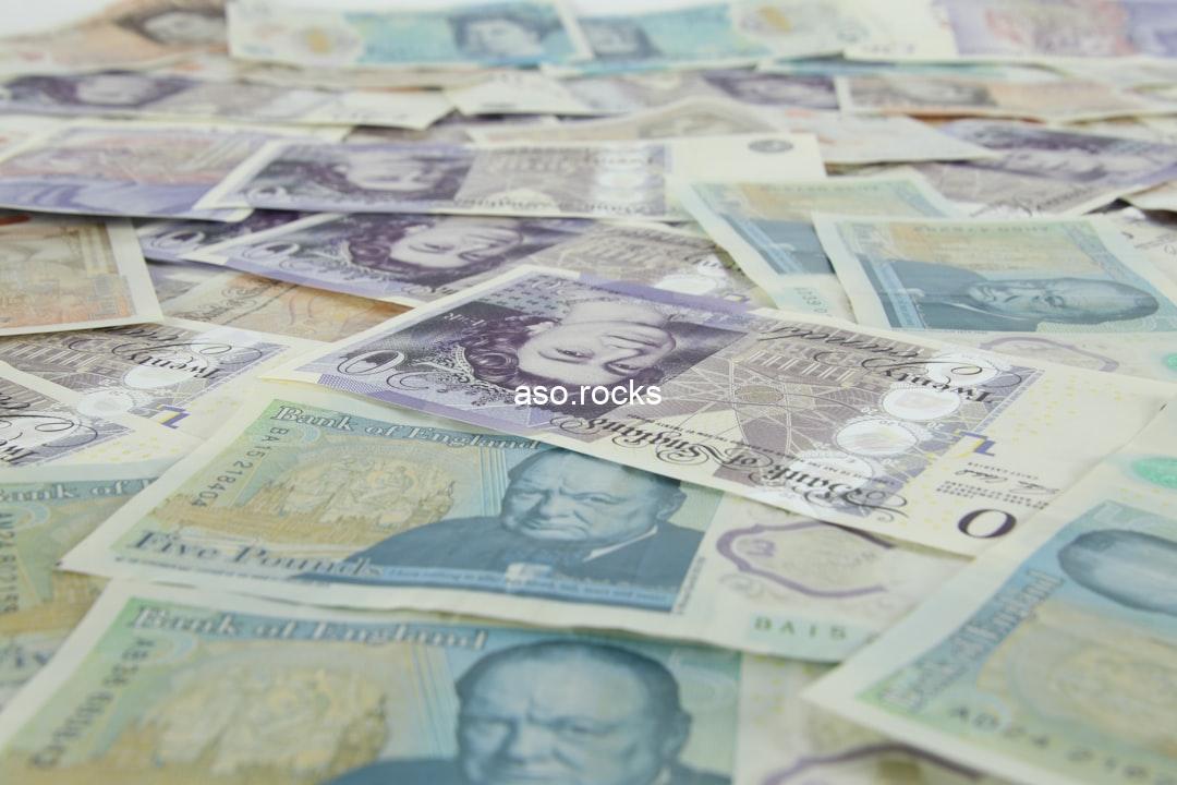 Spread of British pound sterling banknotes representing GBP to naira exchange rates for UK diaspora Nigerians